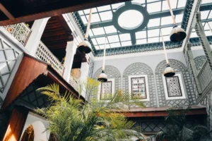 Interior courtyard with plants and hanging lamps